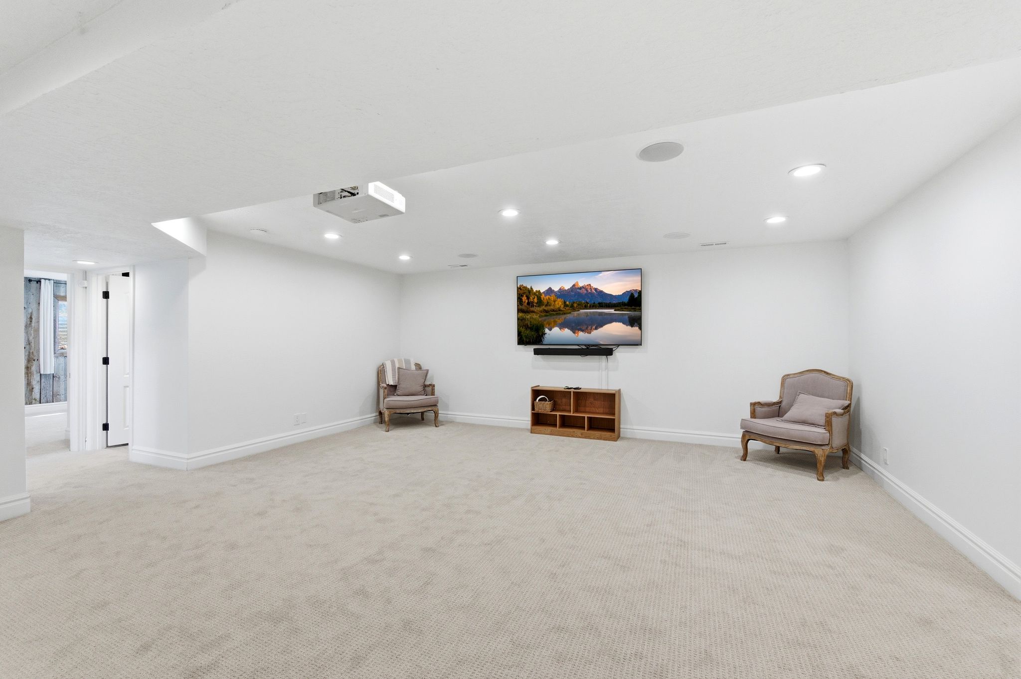 Finished basement rec room with projector and ample space